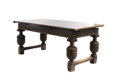 Lot 485 - A Jacobean-style oak draw leaf table