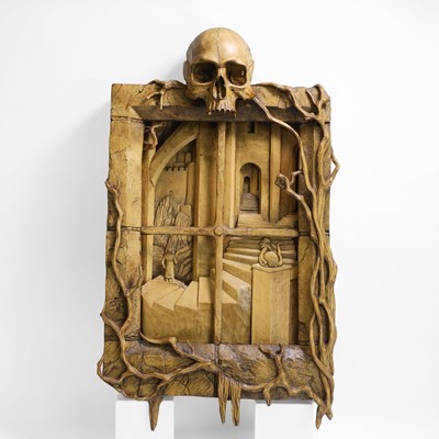 Lot 24 - A carved 'window' surmounted with a skull