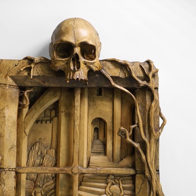 Lot 24 - A carved 'window' surmounted with a skull
