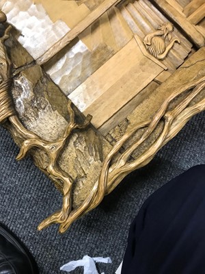 Lot 24 - A carved 'window' surmounted with a skull