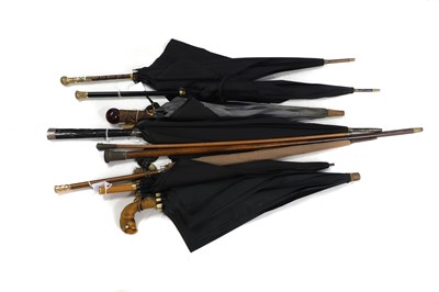 Lot 380A - Four gilt base metal mounted parasols