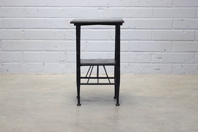 Lot 74 - An ebonised 'Thebes' side table