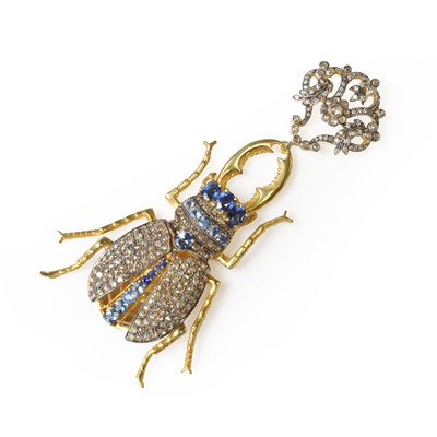 Lot 178 - A silver gilt sapphire and diamond stag beetle pendant