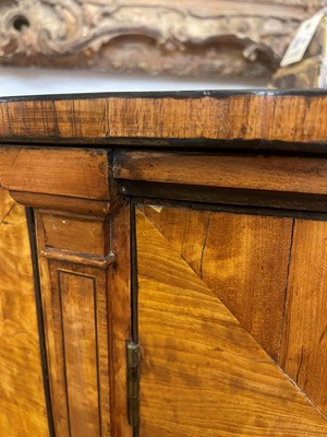 Lot 435 - A George III Sheraton period satinwood and tulipwood demilune side cabinet
