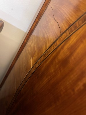 Lot 435 - A George III Sheraton period satinwood and tulipwood demilune side cabinet