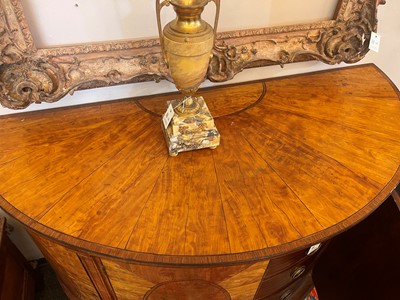 Lot 435 - A George III Sheraton period satinwood and tulipwood demilune side cabinet