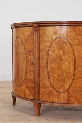 Lot 435 - A George III Sheraton period satinwood and tulipwood demilune side cabinet