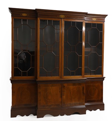 Lot 491 - A George III-style mahogany breakfront bookcase