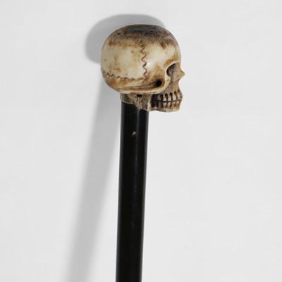 Lot 484 - An ebonised swagger stick
