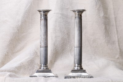 Lot 550 - A pair of Edwardian silver candlesticks