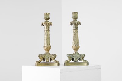 Lot 35 - A pair of George IV brass candlesticks