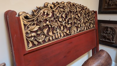 Lot 89 - A pair of carved, gilt and lacquered headboards