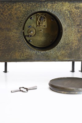 Lot 167 - A Glasgow School planished brass mantel clock