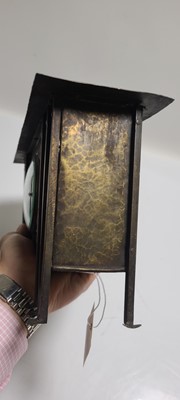 Lot 167 - A Glasgow School planished brass mantel clock