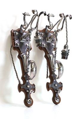 Lot 116 - A pair of Arts and Crafts silver-plated wall lights