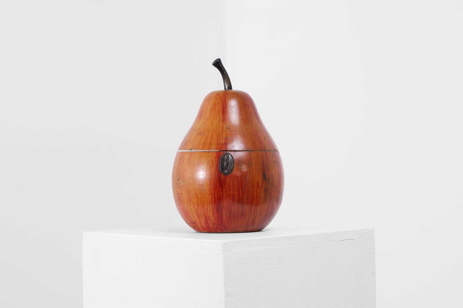 Lot 655 - A George III fruitwood pear-shaped tea caddy