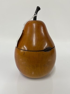 Lot 655 - A George III fruitwood pear-shaped tea caddy
