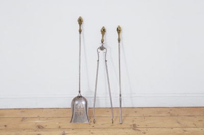 Lot 137 - A set of three Regency brass and steel fire tools