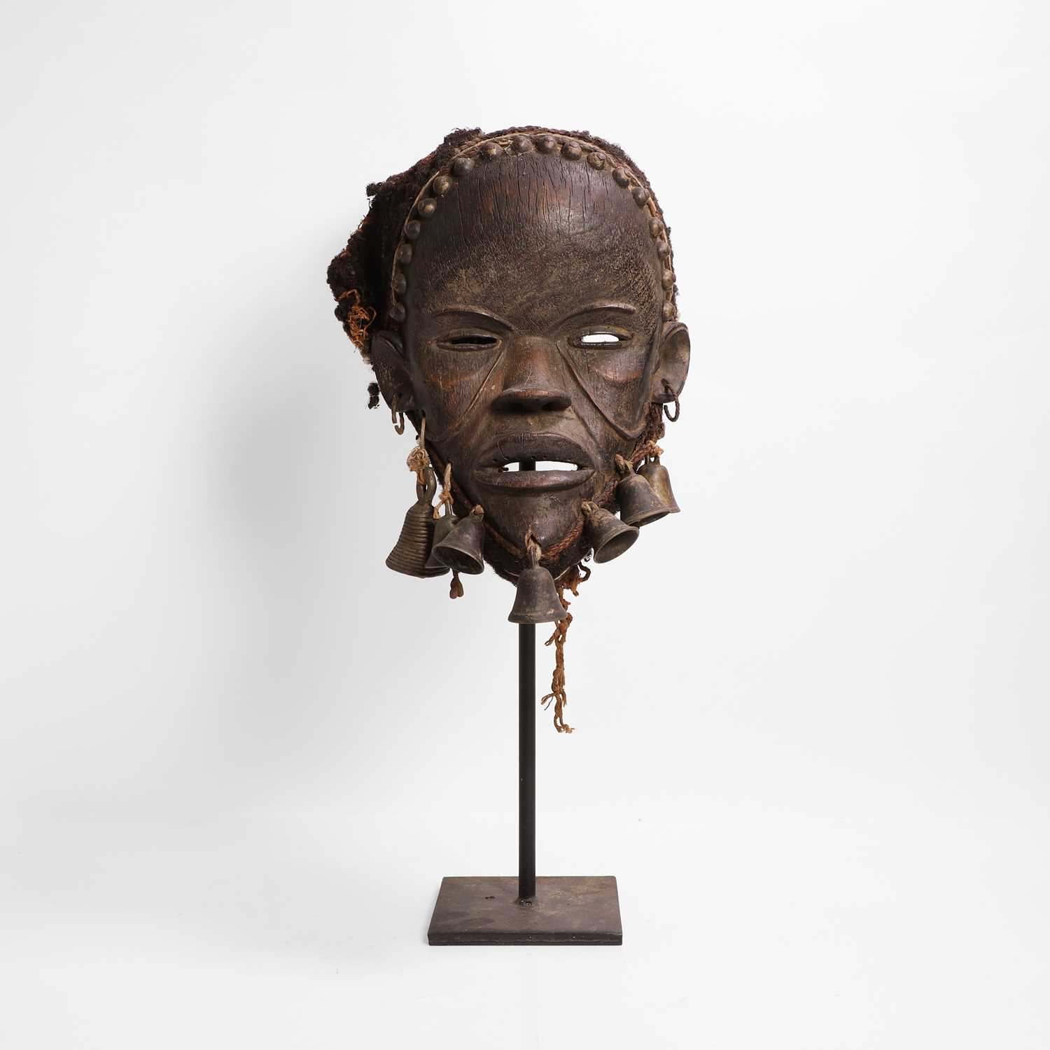 Lot 102 - A carved hardwood mask