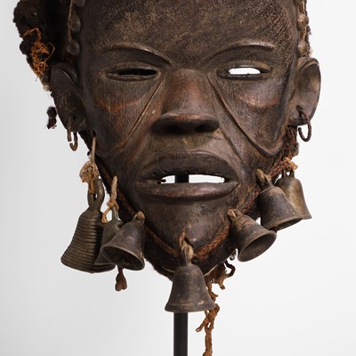 Lot 102 - A carved hardwood mask