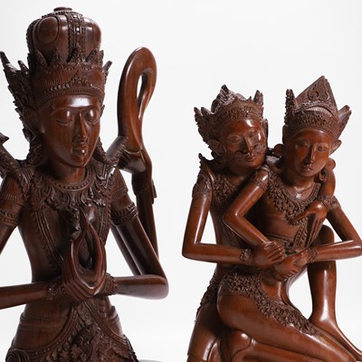 Lot 387 - A group of carved wood figures