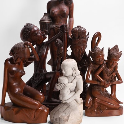 Lot 387 - A group of carved wood figures