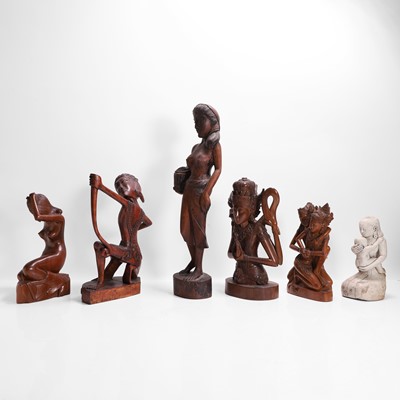 Lot 387 - A group of carved wood figures