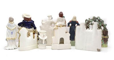 Lot 148 - A collection of Staffordshire pottery figures