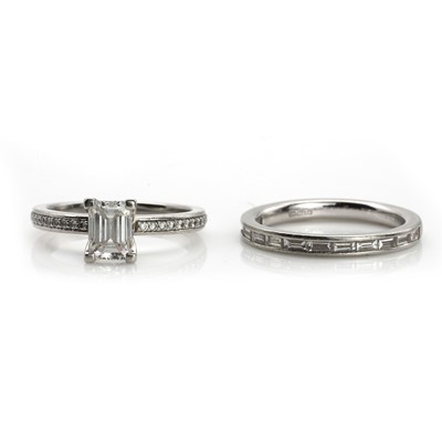 Lot 277 - A platinum single stone diamond ring and a half eternity band