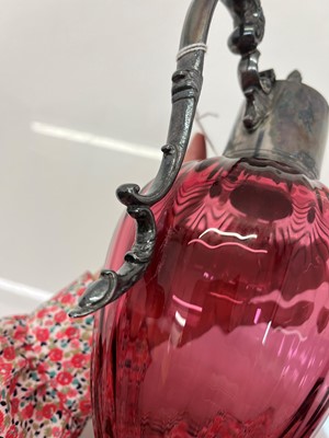 Lot 33 - A silver mounted cranberry glass claret jug