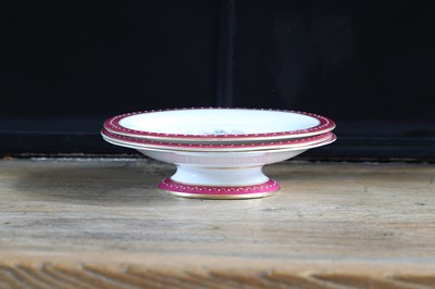 Lot 365 - A Royal Worcester porcelain cake stand and two plates