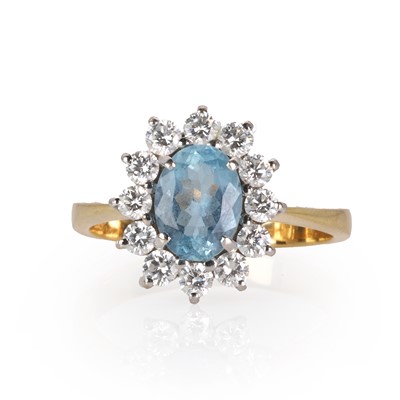 Lot 141 - An 18ct gold aquamarine and diamond cluster ring