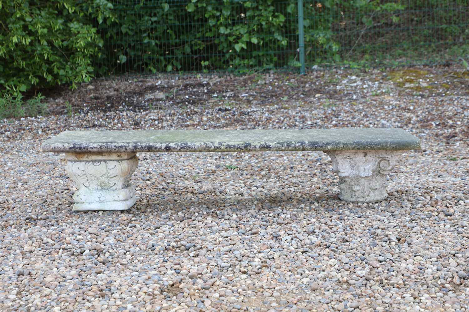 Lot 582 - A stone bench,