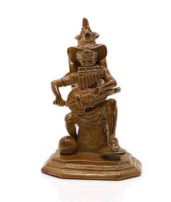 Lot 100 - A Doulton stoneware 'Merry Musician' figure