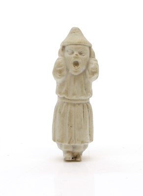 Lot 73 - A small pottery figure