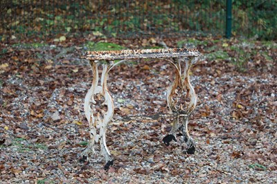 Lot 190 - A cast iron garden table