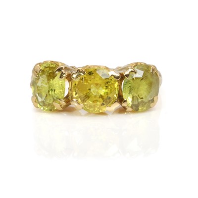 Lot 216 - A three stone yellow and green sapphire ring