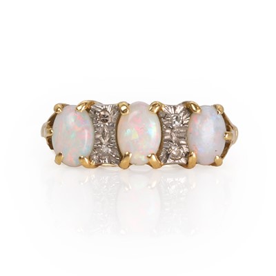 Lot 169 - An 18ct gold opal and diamond three stone ring