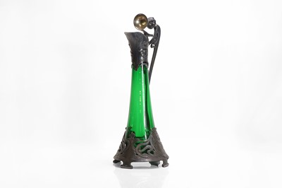 Lot 170 - A German Art Nouveau pewter and glass claret jug