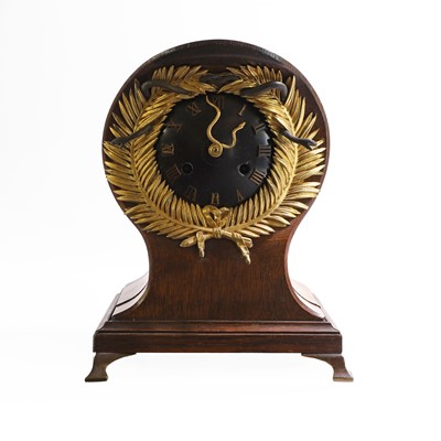 Lot 257 - A French oak and gilt-bronze memento mori mantel clock