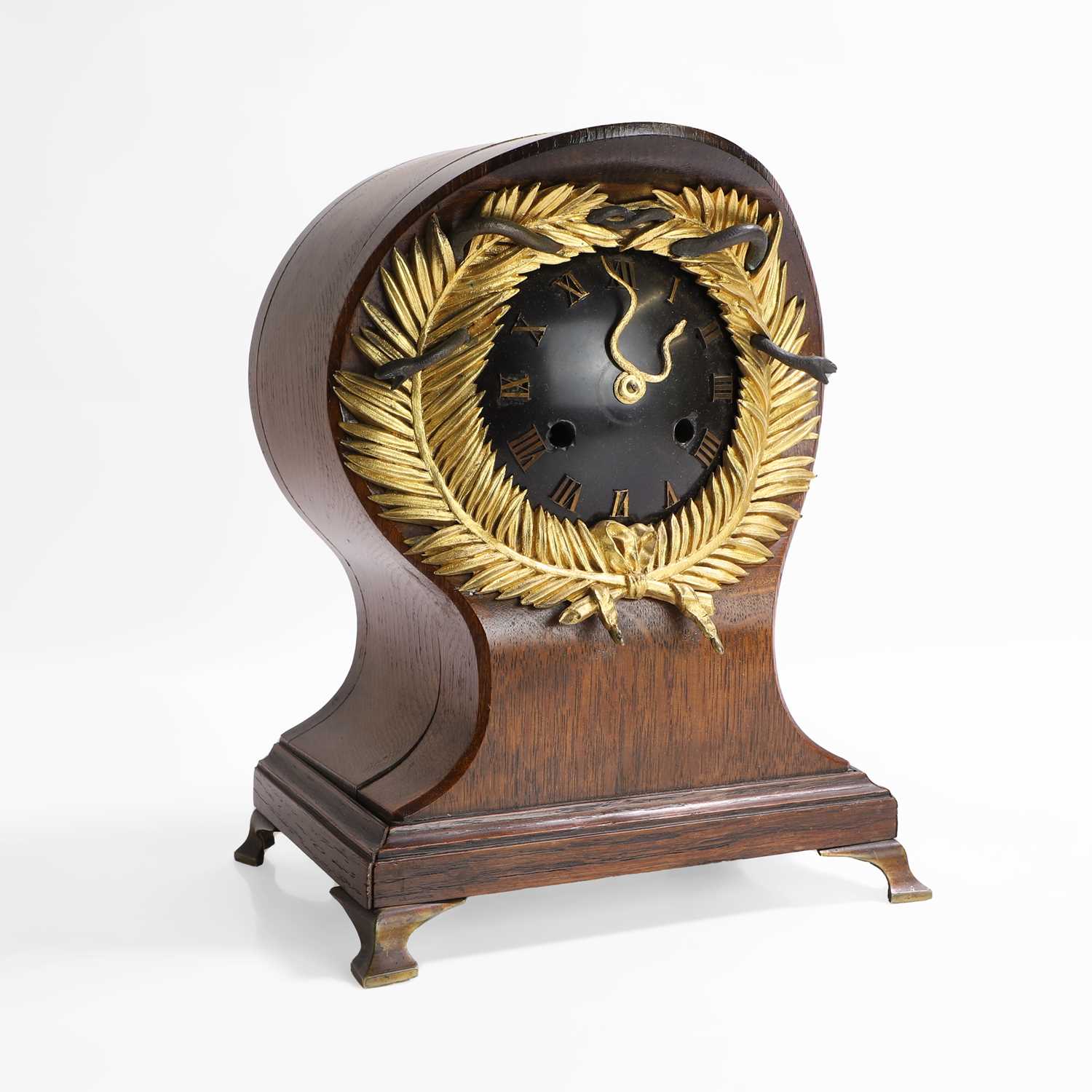 Lot 257 - A French oak and gilt-bronze memento mori mantel clock