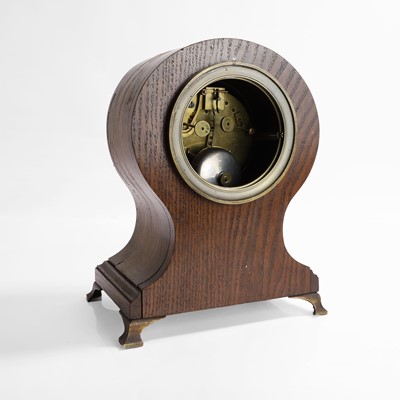 Lot 257 - A French oak and gilt-bronze memento mori mantel clock