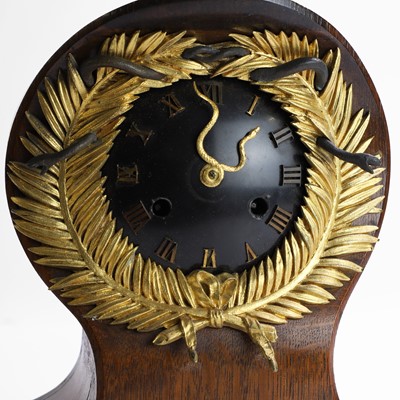 Lot 257 - A French oak and gilt-bronze memento mori mantel clock