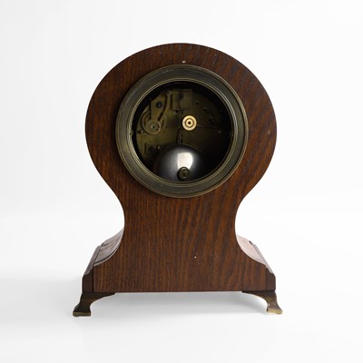 Lot 257 - A French oak and gilt-bronze memento mori mantel clock