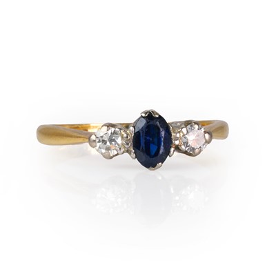 Lot 153 - A sapphire and diamond three stone ring