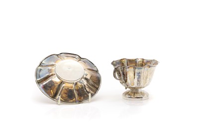 Lot 38 - A silver teacup and saucer