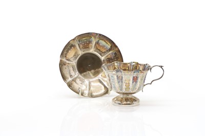 Lot 38 - A silver teacup and saucer