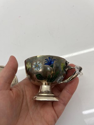 Lot 37 - Two sets of silver and enamelled teacups and saucers