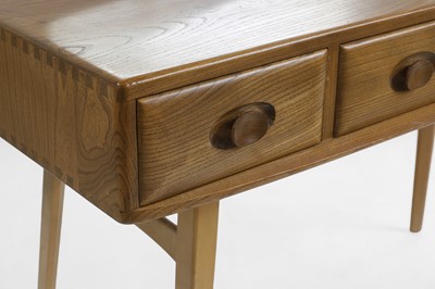 Lot 416 - An Ercol elm dressing table and stool