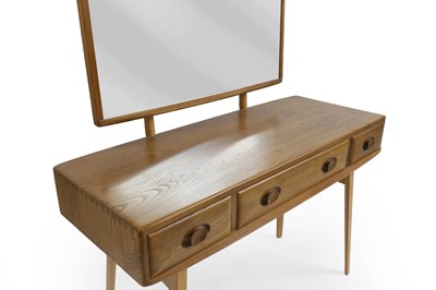 Lot 416 - An Ercol elm dressing table and stool
